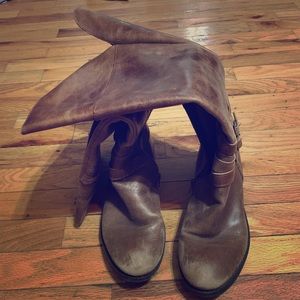 Brown leather riding boots.
